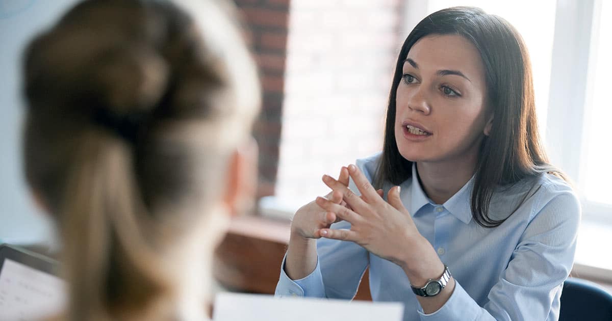 Female business manager talking to a colleague