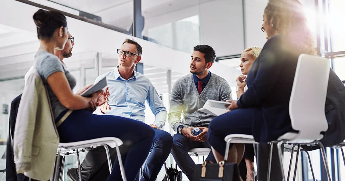 Relaxed office meeting with chairs only