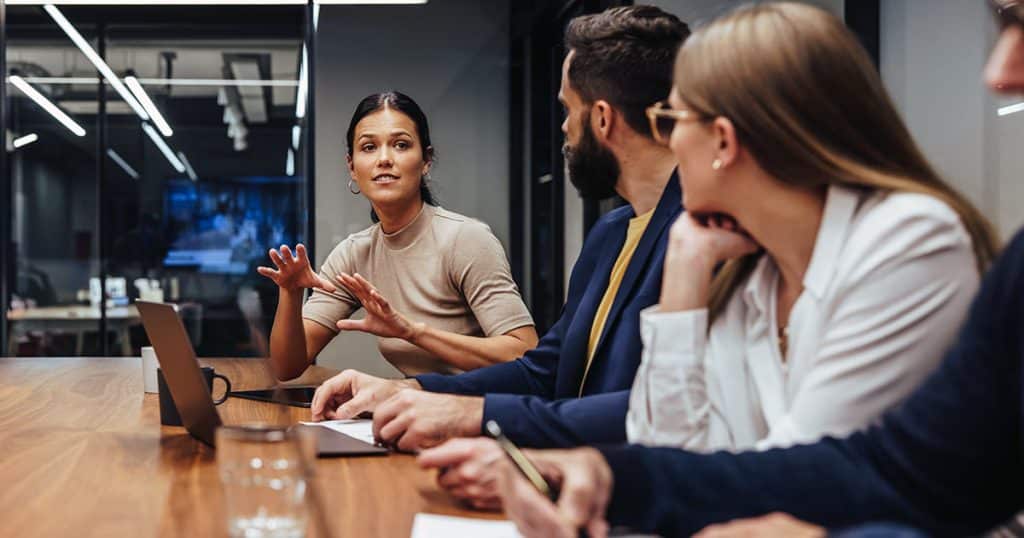 Woman making a point in a team meeting