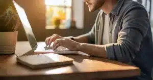 Young man using laptop at desk